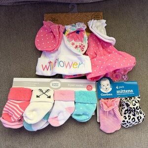 Variety of NWT baby mittens, hats, and socks